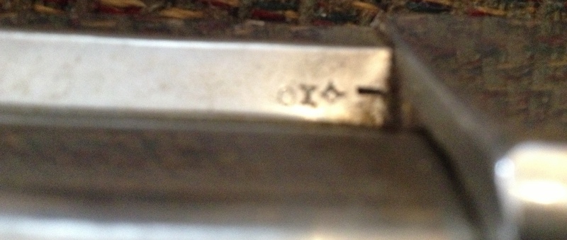 This stamp is on the left under side of the barrel.  A bit blurry but I think the shapes can be made out OK...